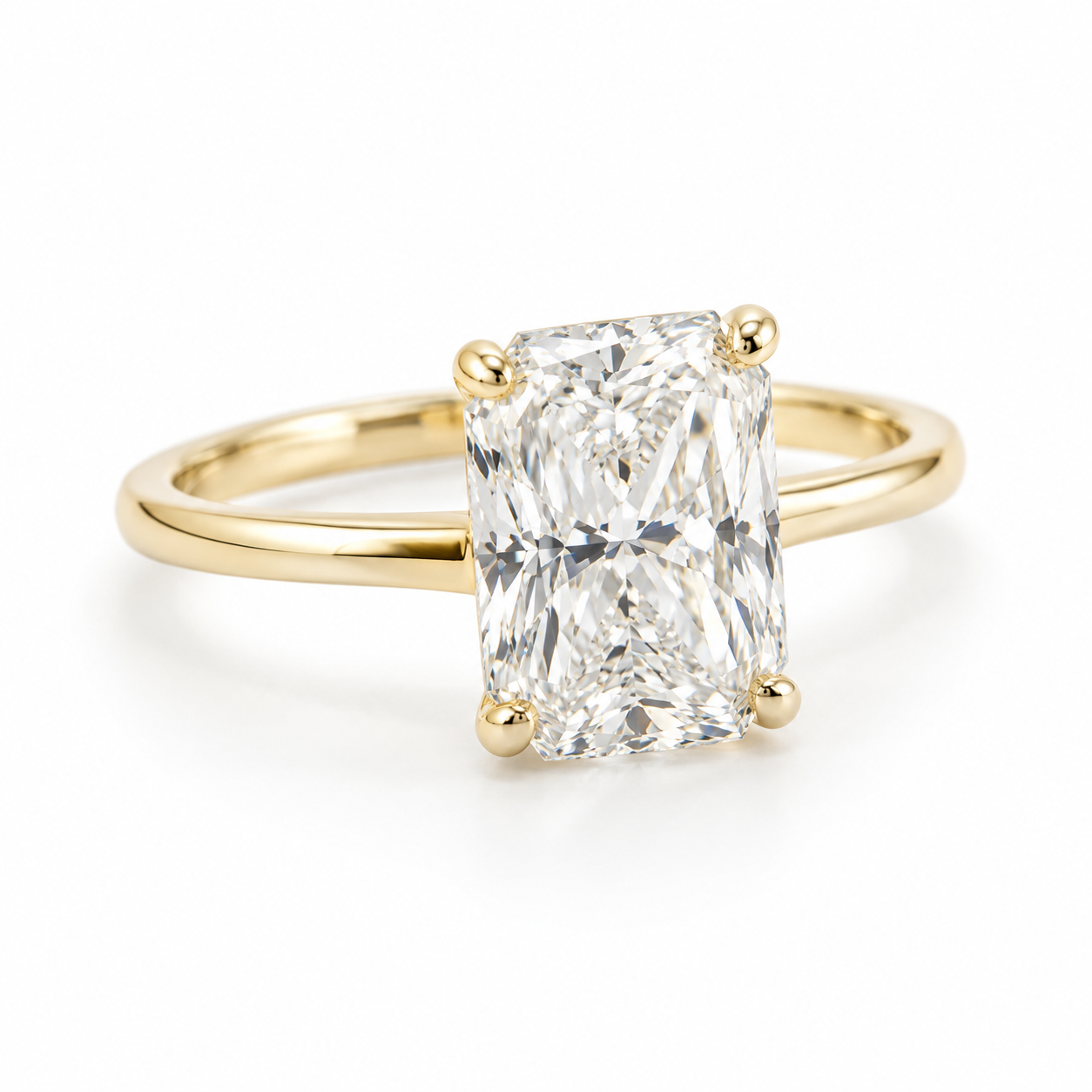 Radiant-cut diamond solitaire on a delicate gold band